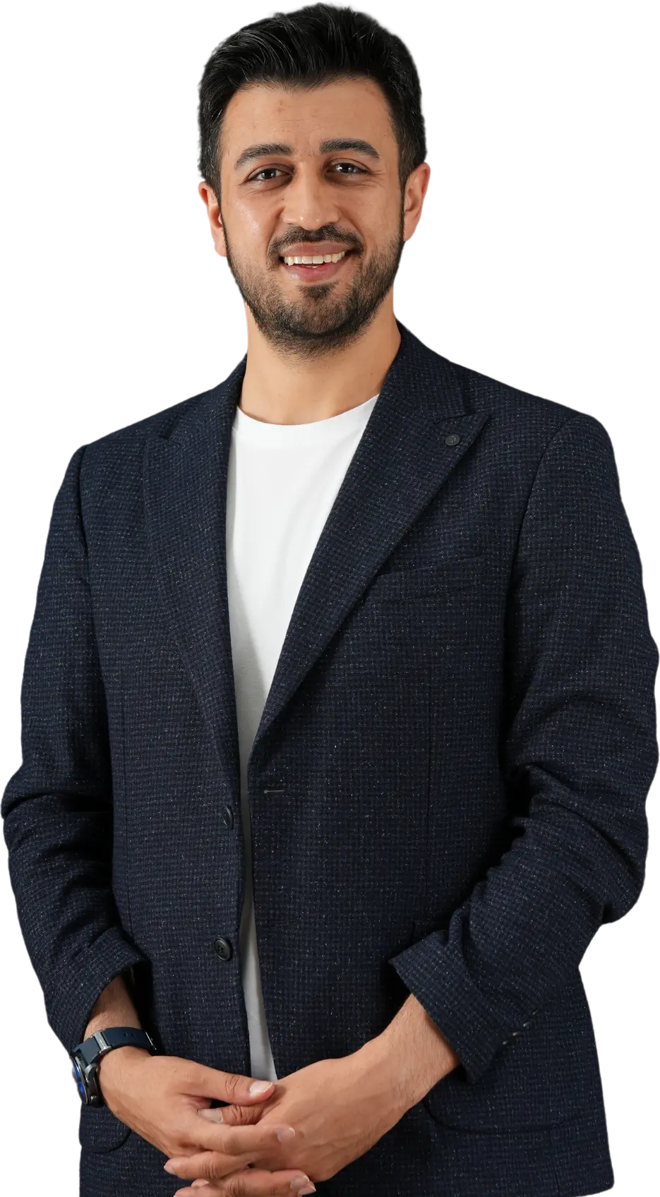 Assoc. Prof. Dr. Nesrettin Fatih Turgut wearing a dark blazer and white t-shirt, smiling with hands folded in front.