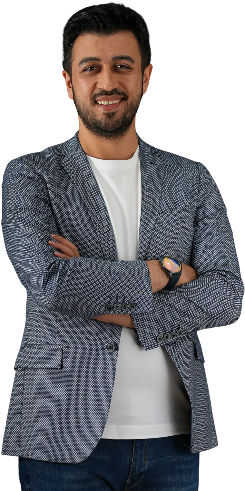 Assoc. Prof. Dr. Nesrettin Fatih Turgut wearing a patterned navy blazer and white t-shirt, smiling with his arms crossed.