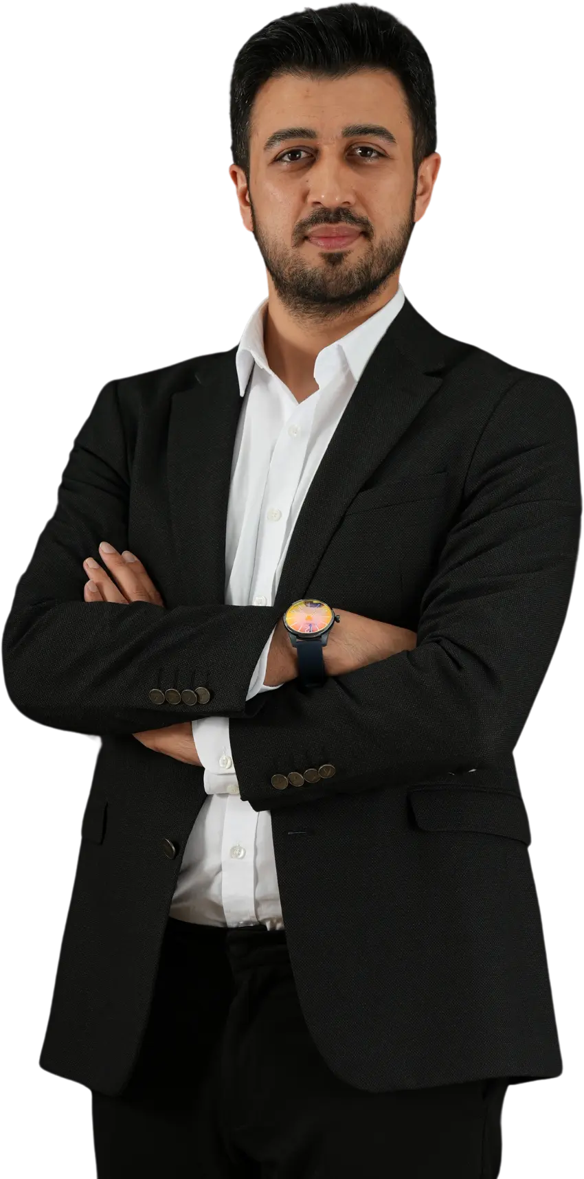 Assoc. Prof. Dr. Nesrettin Fatih Turgut standing confidently in a black suit and white dress shirt with arms crossed.