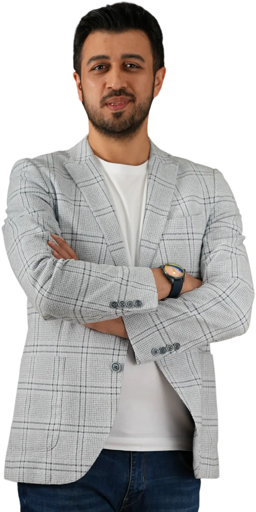 Assoc. Prof. Dr. Nesrettin Fatih Turgut standing with arms crossed, wearing a grey plaid blazer and white t-shirt, looking confident.